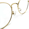 Monturas de anteojos más nuevas para mujer, diseño clásico, tamaño personalizado, aleación de cobre, montura óptica Unisex redonda